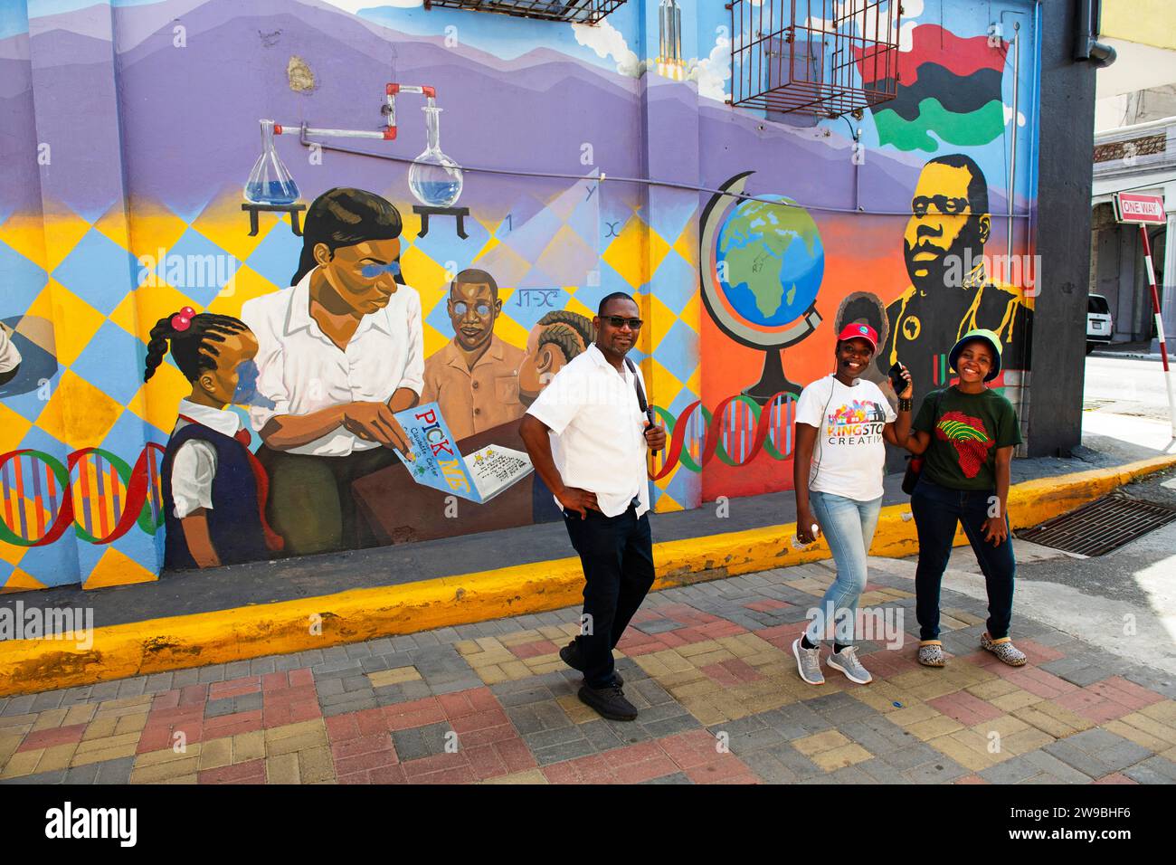 Guides in front of Marcus Garvey, EducationMural, Water Lane, Downtown