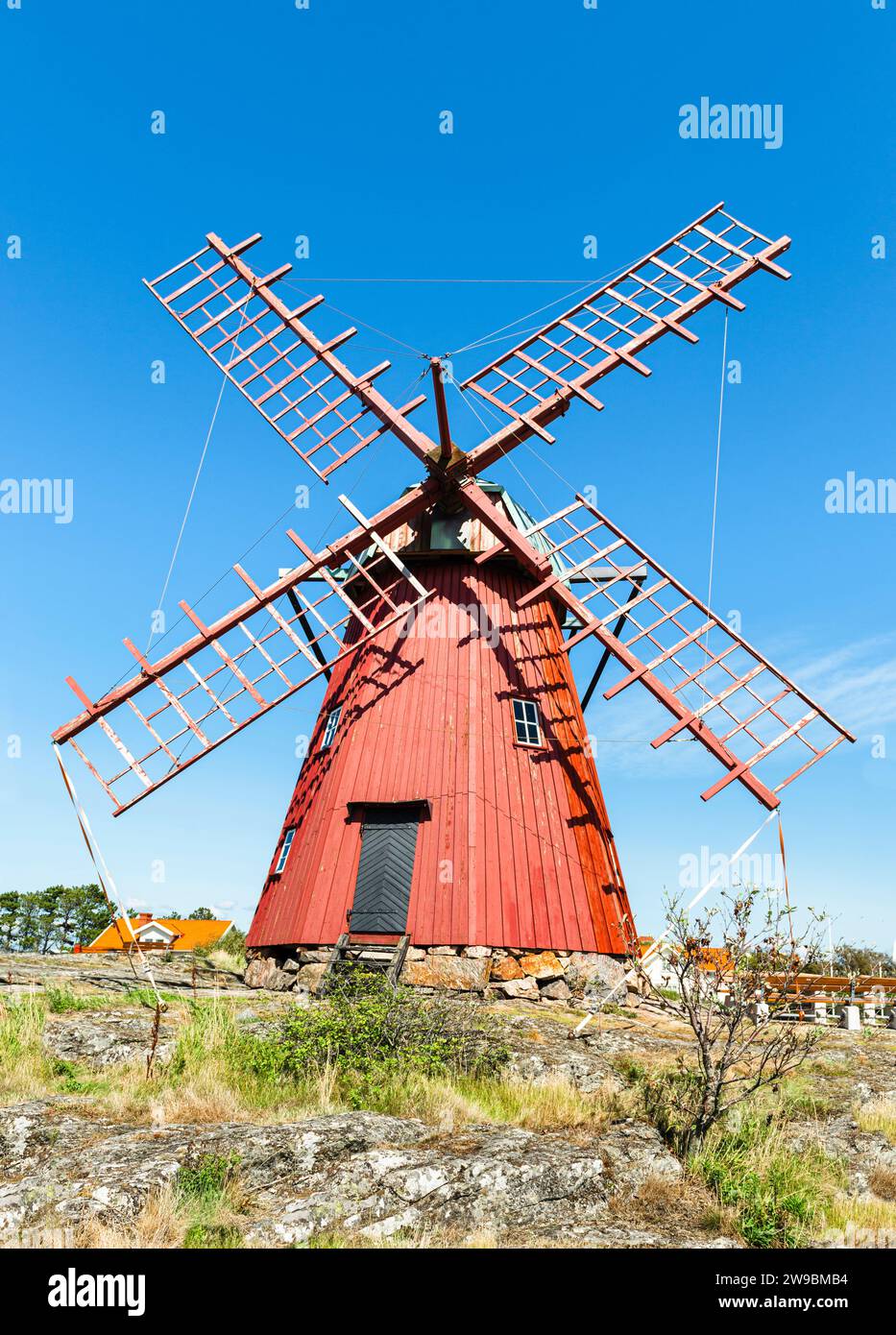 Historic red windmill in Mollösund on the island of Orust in the archipelago of the Swedish west coast Stock Photo