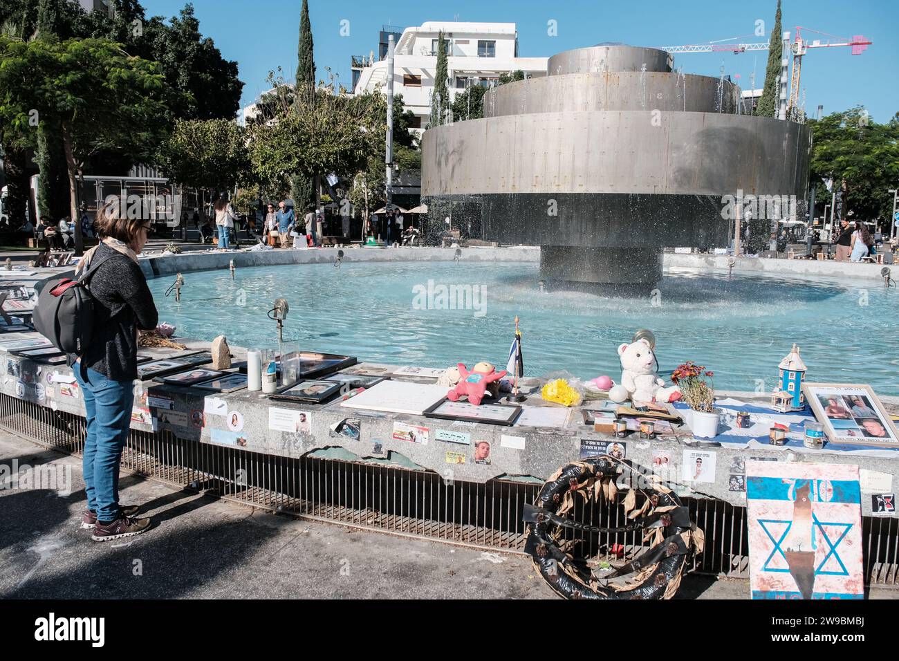 Tel Aviv, Israel. 26th Dec, 2023. Women light memorial candles for the