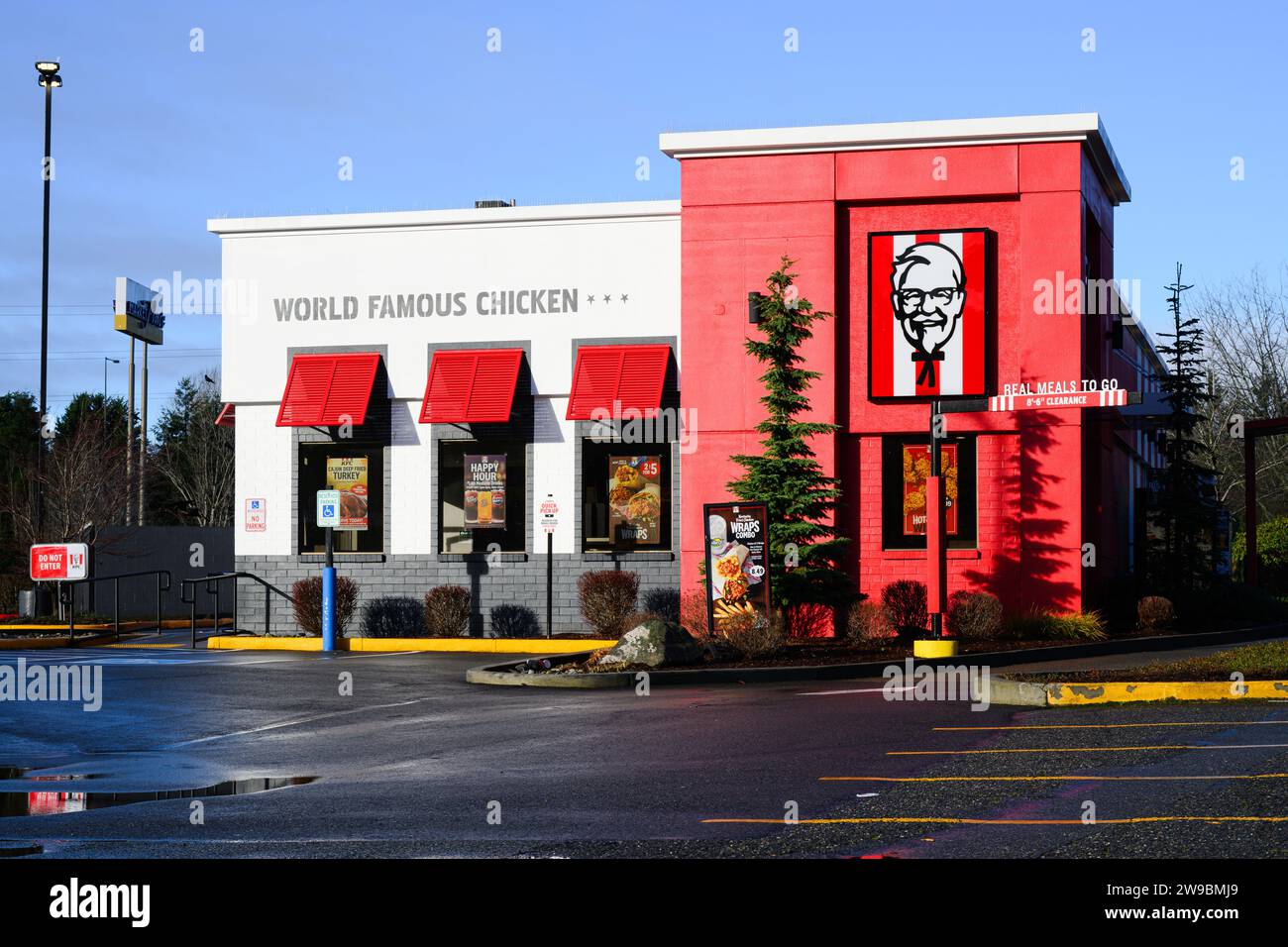 Bellevue, WA, USA - December 10, 2023; Outside of red and white Kentucky Fried Chicken fast food restaurant Stock Photo