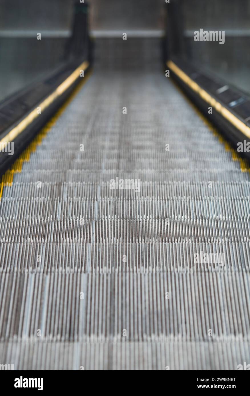 Looking down an empty escalator Stock Photo