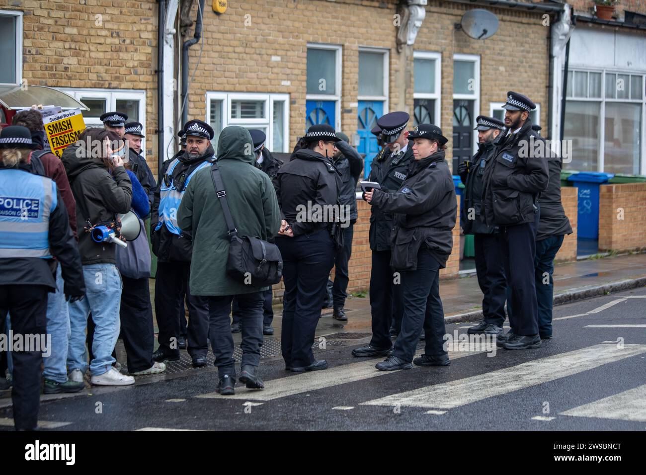 Far right and antifascist counter protesters face off at a demonstration about drag queen storytime in South London Stock Photo