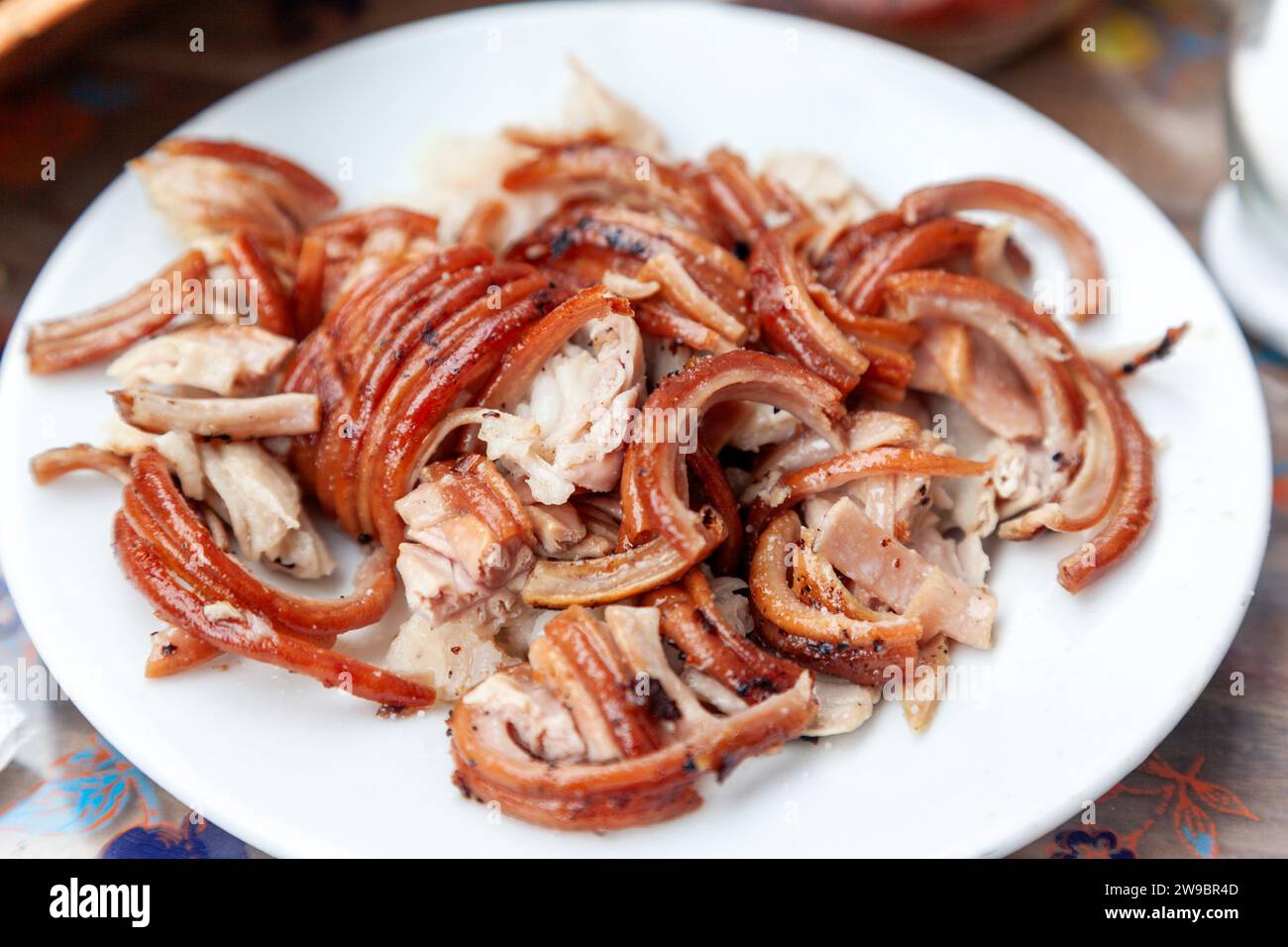 Pieces of kokorec, a popular dish in Turkey, Greece and Balkans, consisting of lamb or goat intestines wrapped around seasoned offal, mostly grilled. Stock Photo