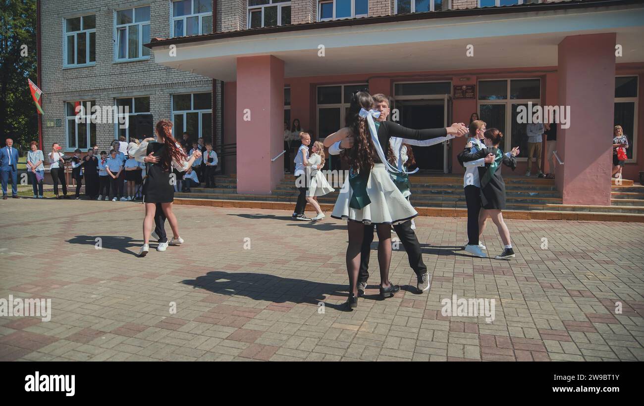 Berezovka, Belarus - May 31, 2023: Belarusian graduates dance a waltz on the day of graduation. Stock Photo