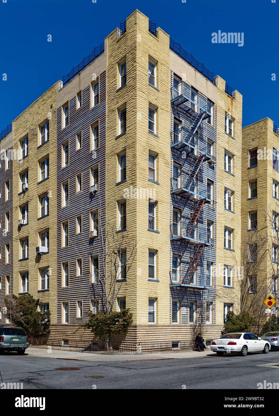 301 Brightwater Court is a blue and grey brick and yellow stucco