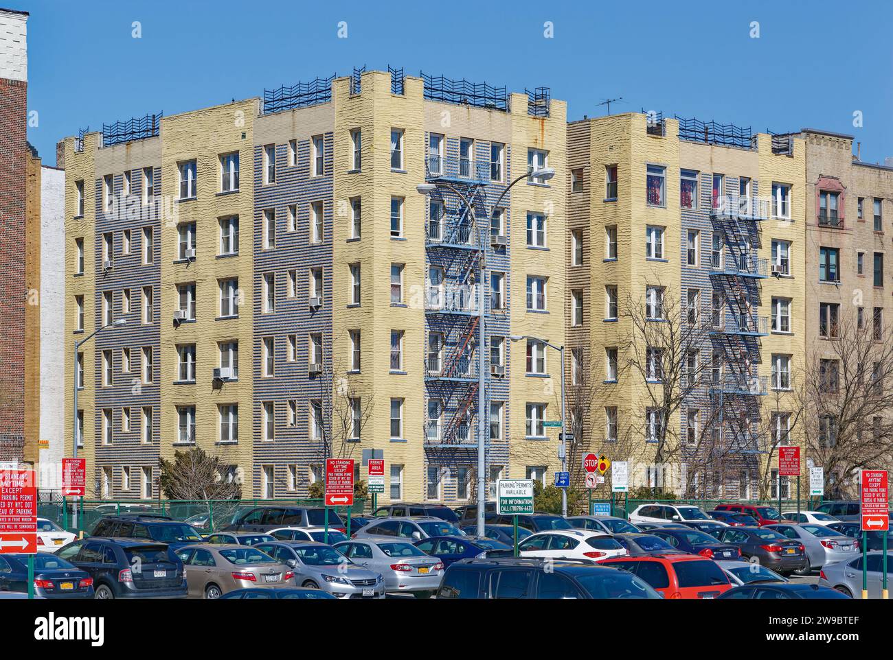 301 Brightwater Court is a blue and grey brick and yellow stucco