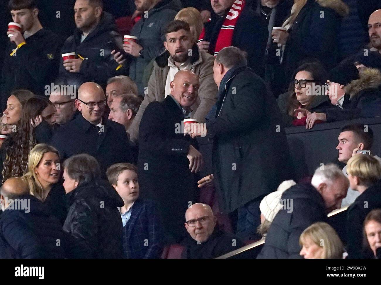 Sir Dave Brailsford (centre) and Patrick Stewart (centre left) in the stands during the Premier League match at Old Trafford, Manchester. Picture date: Tuesday December 26, 2023. Stock Photo