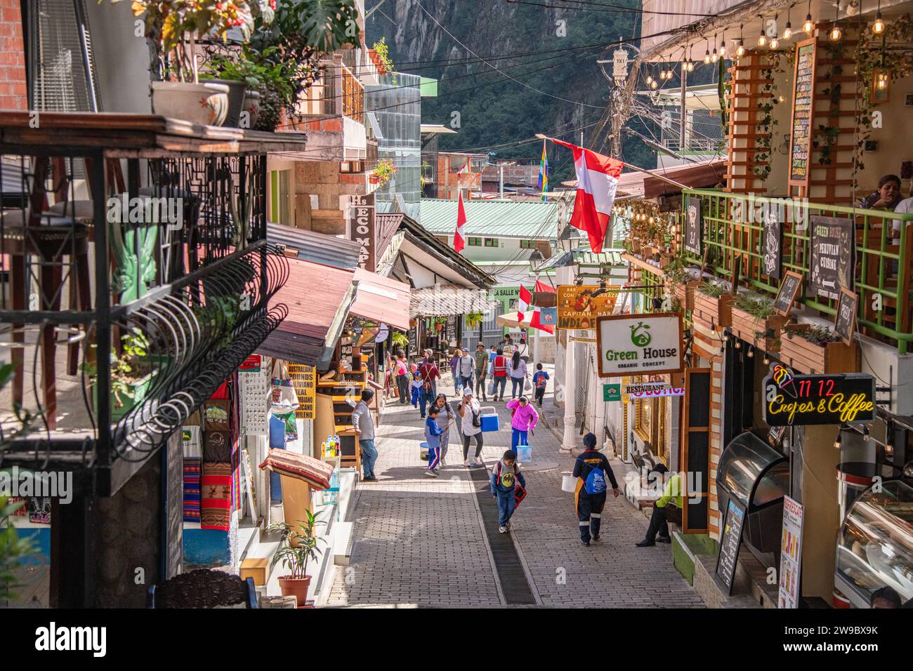 A pedestrian street through Aguas Calientes near Machu Picchu in Peru Stock Photo