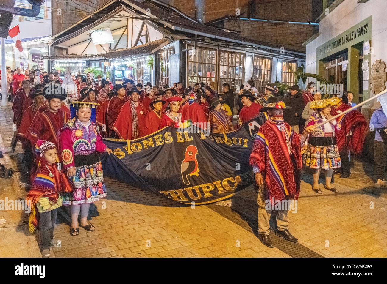 A ceremony procession in Aguas Calientes, Peru, celebrating the anniversary of Machu Picchu being declared a wonder of the world Stock Photo