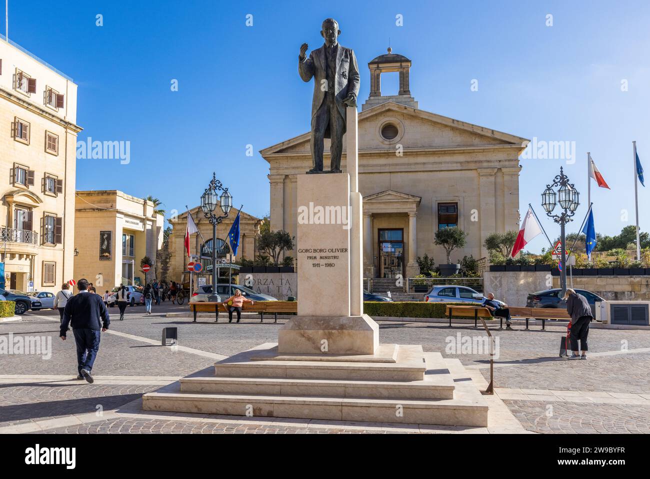 Statue of former Prime Minister Ġorġ Borg Olivier in front of the Stock Exchange building on Castille Square in Valletta, Malta Stock Photo