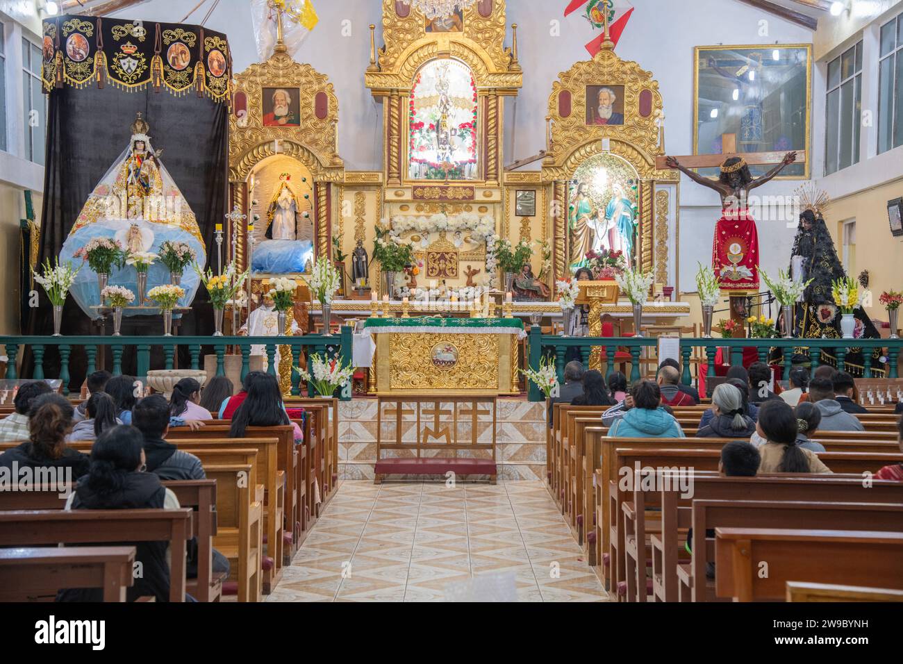 A sermon service inside Virgen del Carmen church at Aguas Calientes near Machu Picchu in Peru Stock Photo
