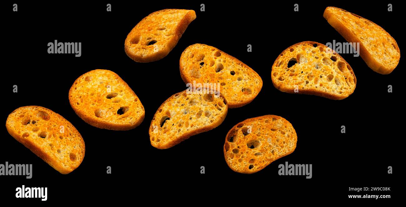 Bruschetta crackers, bread croutons on black background  Stock Photo