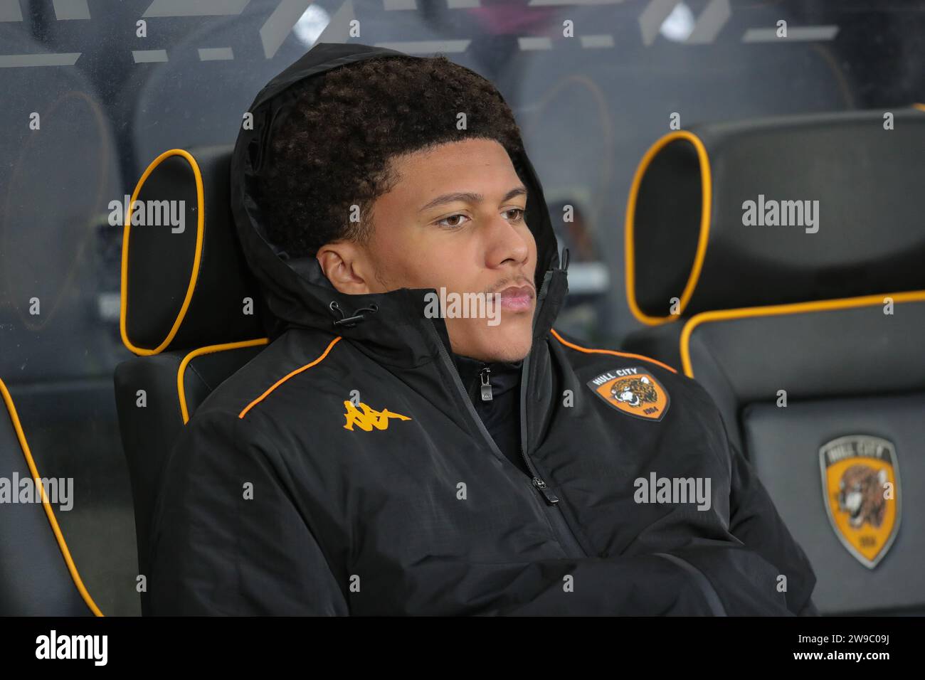 Tyrell Sellars-Fleming of Hull City looks on from the dug out during the Sky Bet Championship match Hull City vs Sunderland at MKM Stadium, Hull, United Kingdom, 26th December 2023  (Photo by James Heaton/News Images) Stock Photo