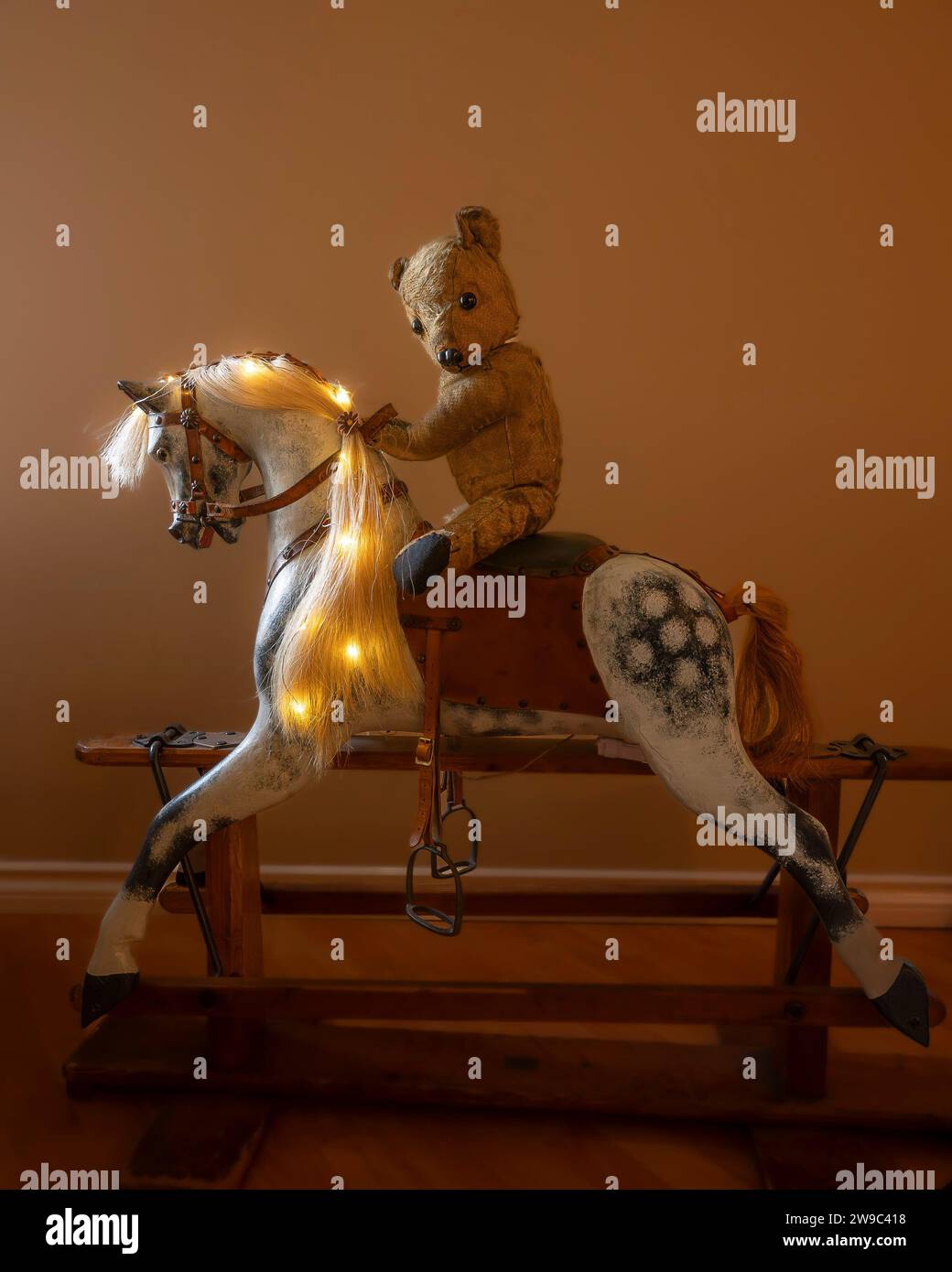 Teddy bear riding Rocking Horse Stock Photo - Alamy