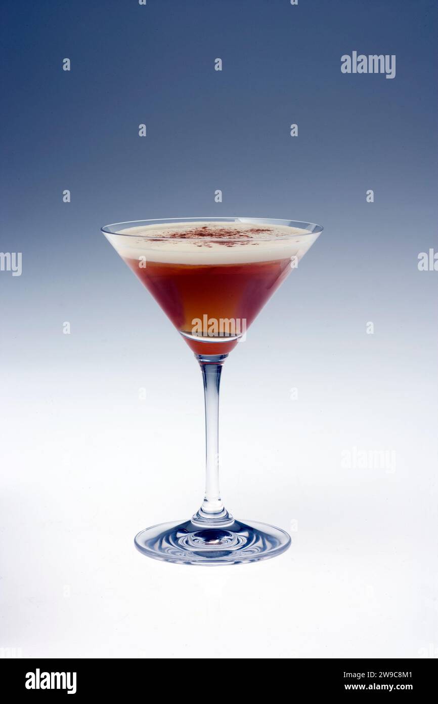 A still life of a chocolate martini in an elegant martini glass photographed on a plain background Stock Photo