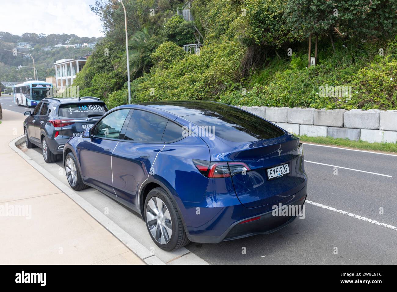 Blue Tesla Model Y parked in Palm Beach,Sydney,Australia in December 2023 Stock Photo