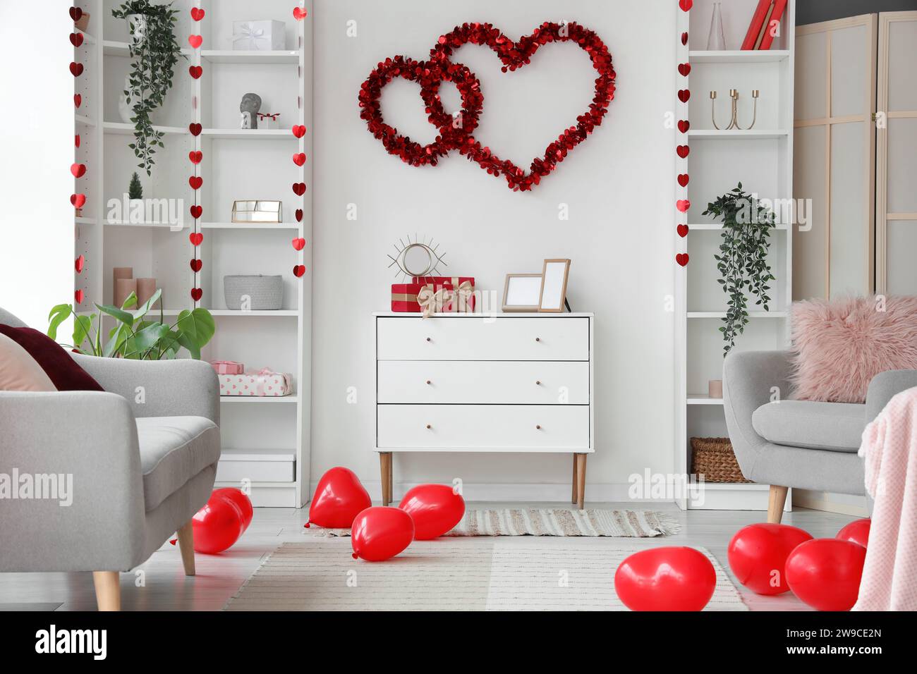 Interior of festive living room decorated with hearts for Valentine's ...