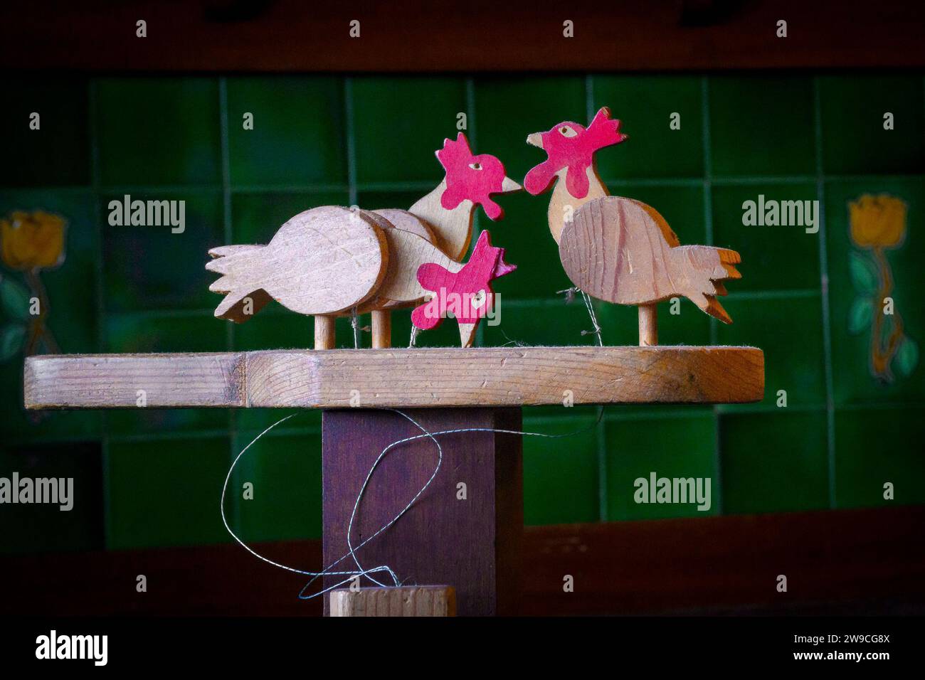 Pecking chickens handmade wooden toy Stock Photo Alamy