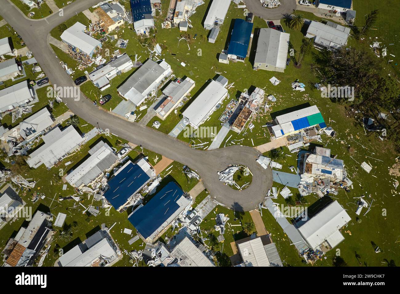 Badly damaged mobile homes after hurricane Ian in Florida residential area. Consequences of natural disaster Stock Photo