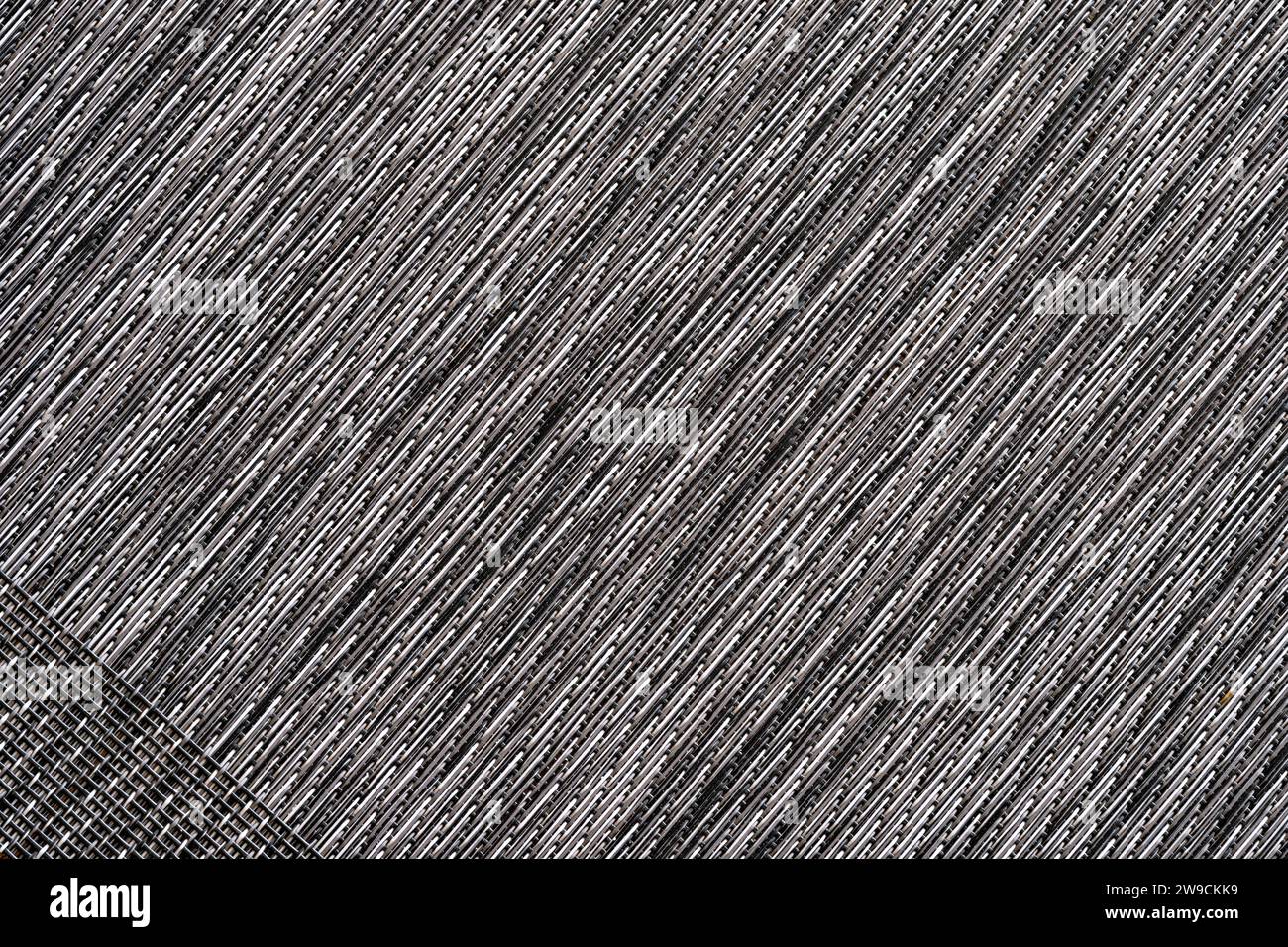 The diagonal patterns in an intricately woven placemat Stock Photo