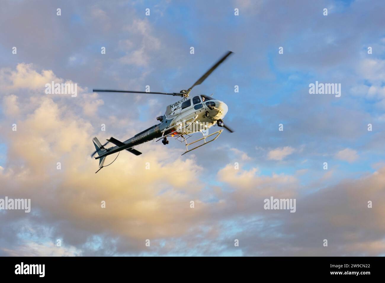 Irvine, CA, USA - December 15, 2023: Orange County Sheriffs helicopter flies over Irvine, CA Stock Photo