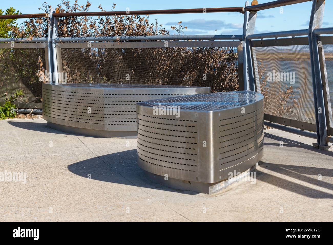 Stainless steel seating and viewpoint fencing installed as part of a major port and shoreline renovation at Port Botany Sydney, Australia in 2020 Stock Photo