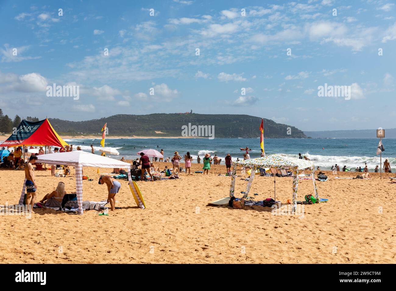 Palm Beach in Sydney Australia people enjoy Boxing Day on the beach taking shade from a hot summers day in Sydney,NSW,Australia,2023 Stock Photo