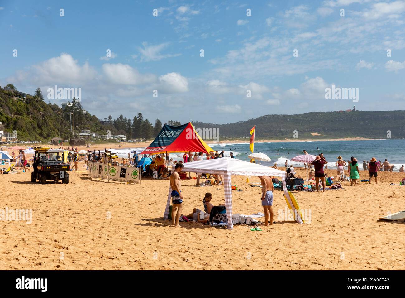 Palm Beach in Sydney Australia people enjoy Boxing Day on the beach taking shade from a hot summers day in Sydney,NSW,Australia,2023 Stock Photo