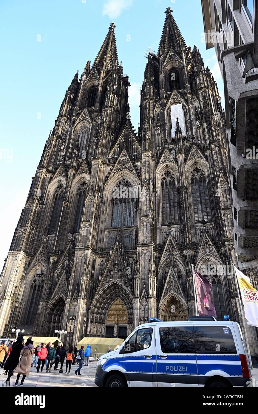 Cologne, Germany. 26th Dec, 2023. Police officers and police cars in