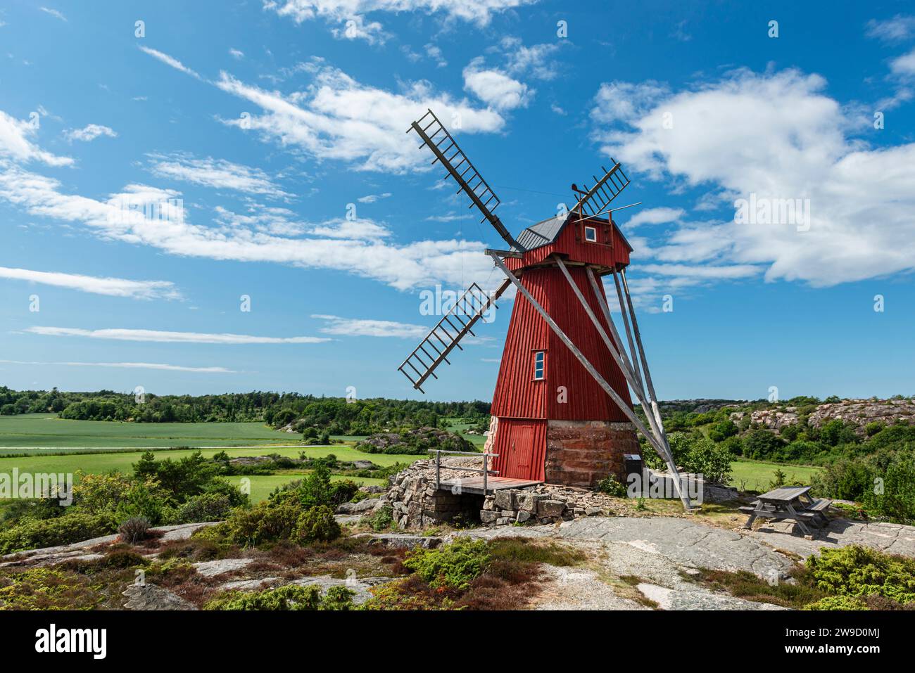 Ulseröd windmill with wooden façade in red colour on a hill near Saltvik in the archipelago of the west coast of Sweden, Bohuslän, Tanumshede Stock Photo