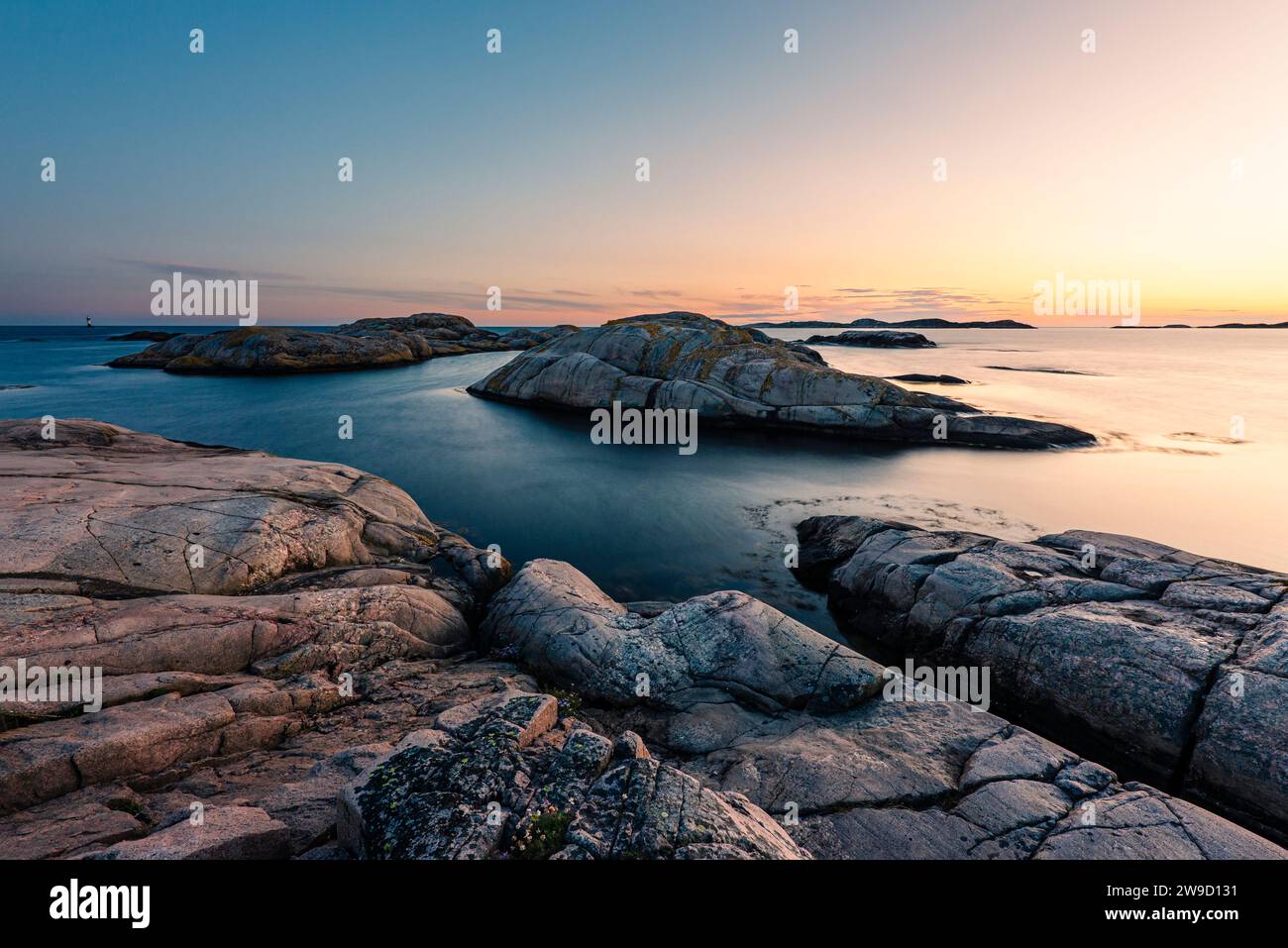 Glowing sunset on the rocks in the Tjurpannan nature reserve in the archipelago of the Swedish west coast Stock Photo