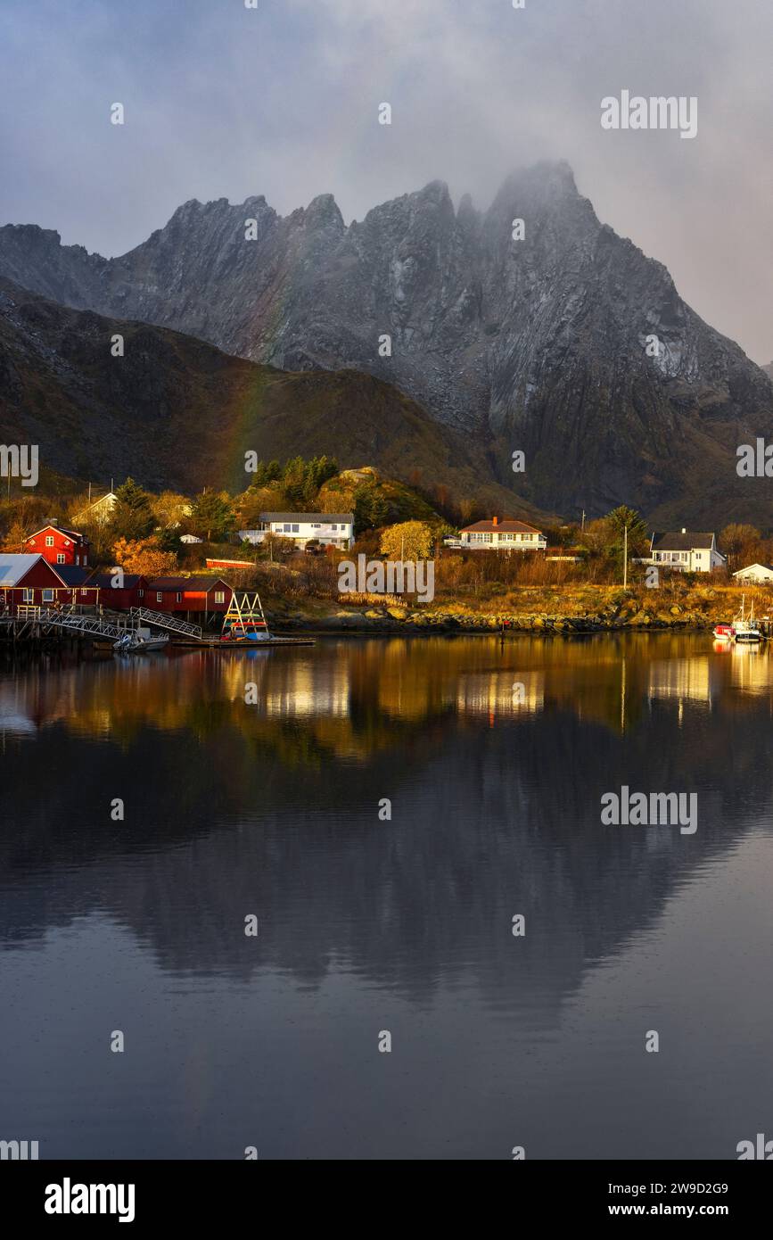 Rainbow at Ballstad village during sunrise, Vestvagoy, Nordland, Lofoten Islands, Norway, Northern Europe Stock Photo