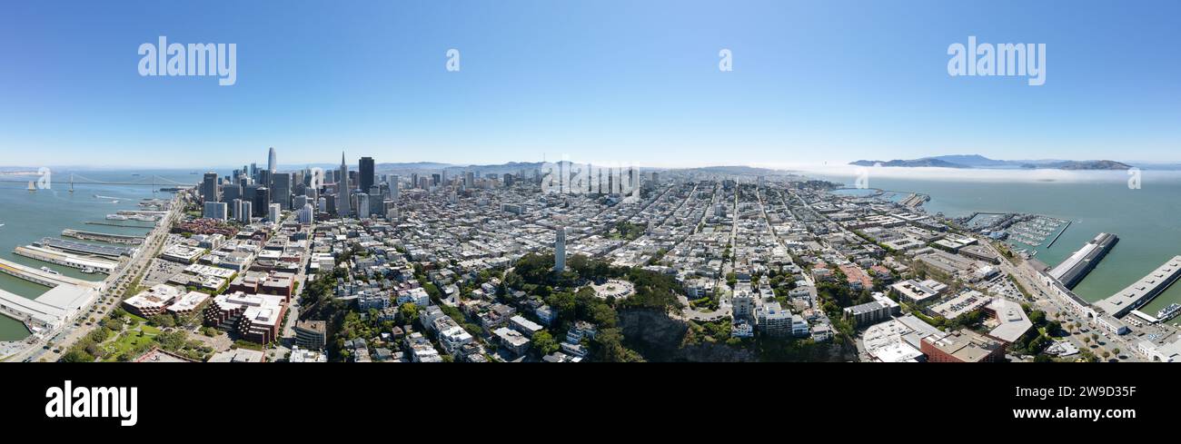 Wide aerial panorama of San Francisco with Coit Tower centered, Salesforce Tower, and Bay Bridge Stock Photo