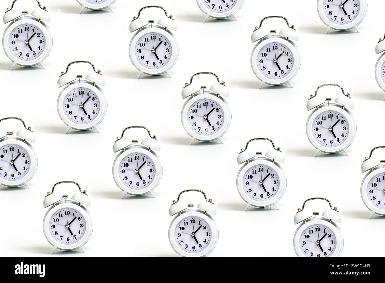 Trendy pattern made with White alarm clocks on White background Stock ...
