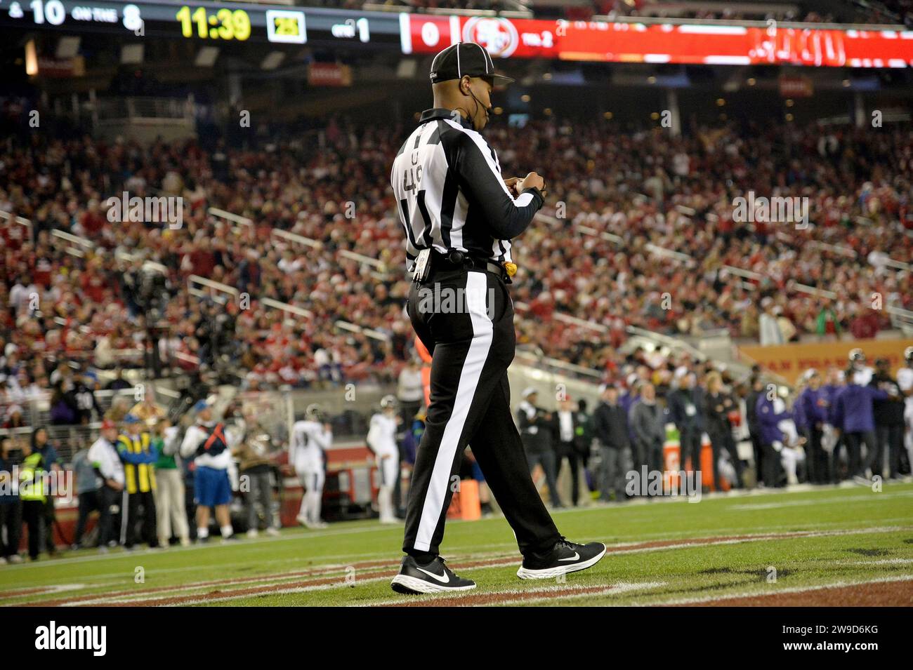 Umpire Alex Moore (49) on the field during an NFL football game between