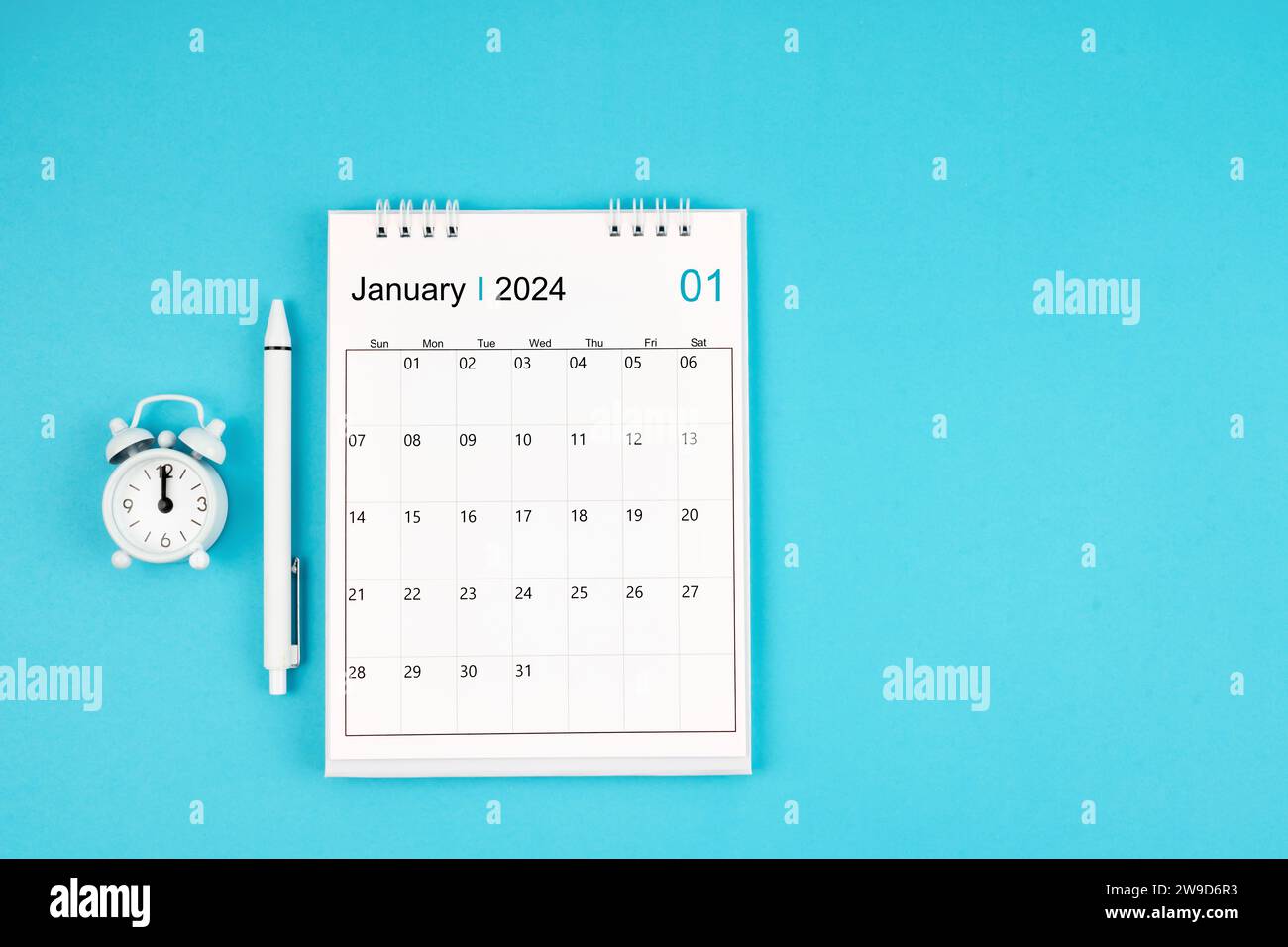 January 2024, Monthly desk calendar for 2024 year and pen with alarm ...