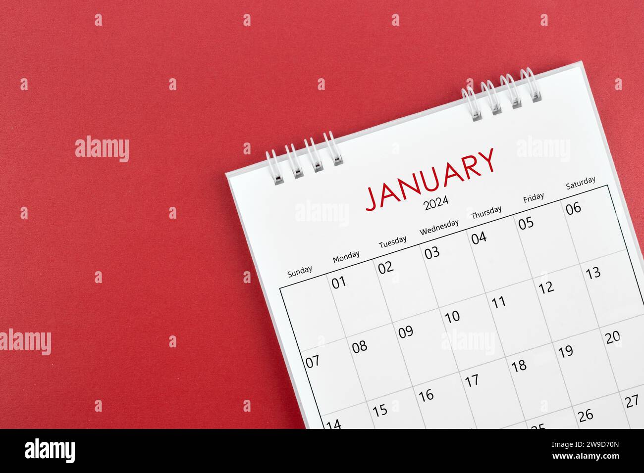 January 2024 desk calendar on red color background Stock Photo - Alamy