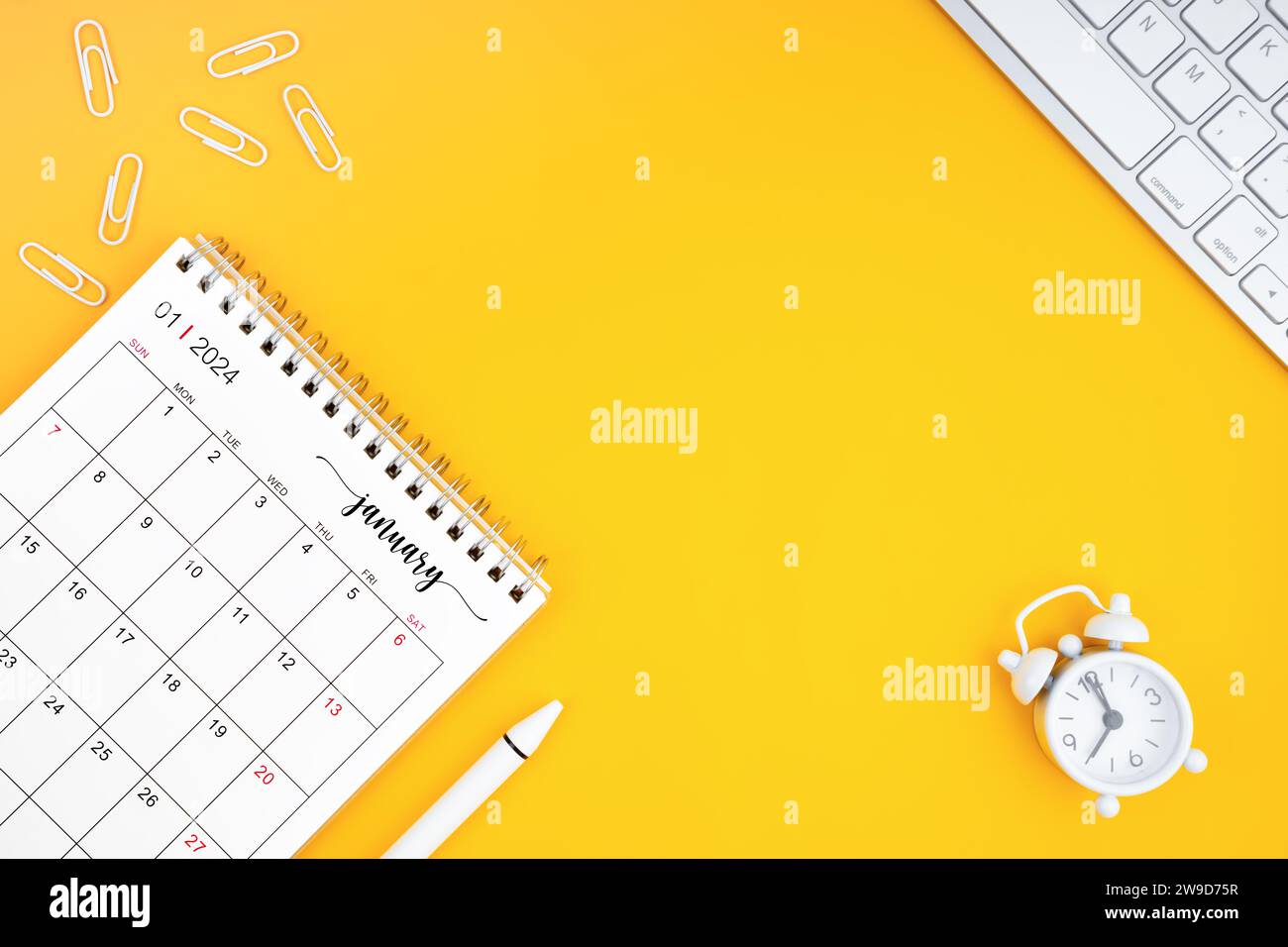 January 2024, Monthly desk calendar for 2024 year and alarm clock with ...