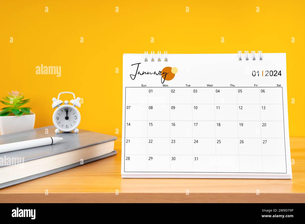 January desk calendar for 2024 year on work table with yellow ...