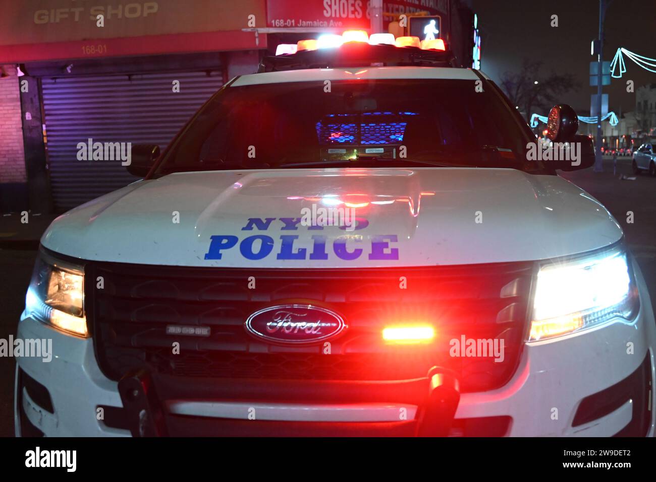 Queens, United States. 27th Dec, 2023. NYPD car seen at the scene of a