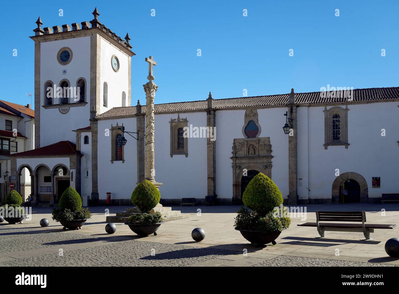 Pillory and Church of Saint John the Baptist in the center of the city of Bragança, Portugal. Stock Photo