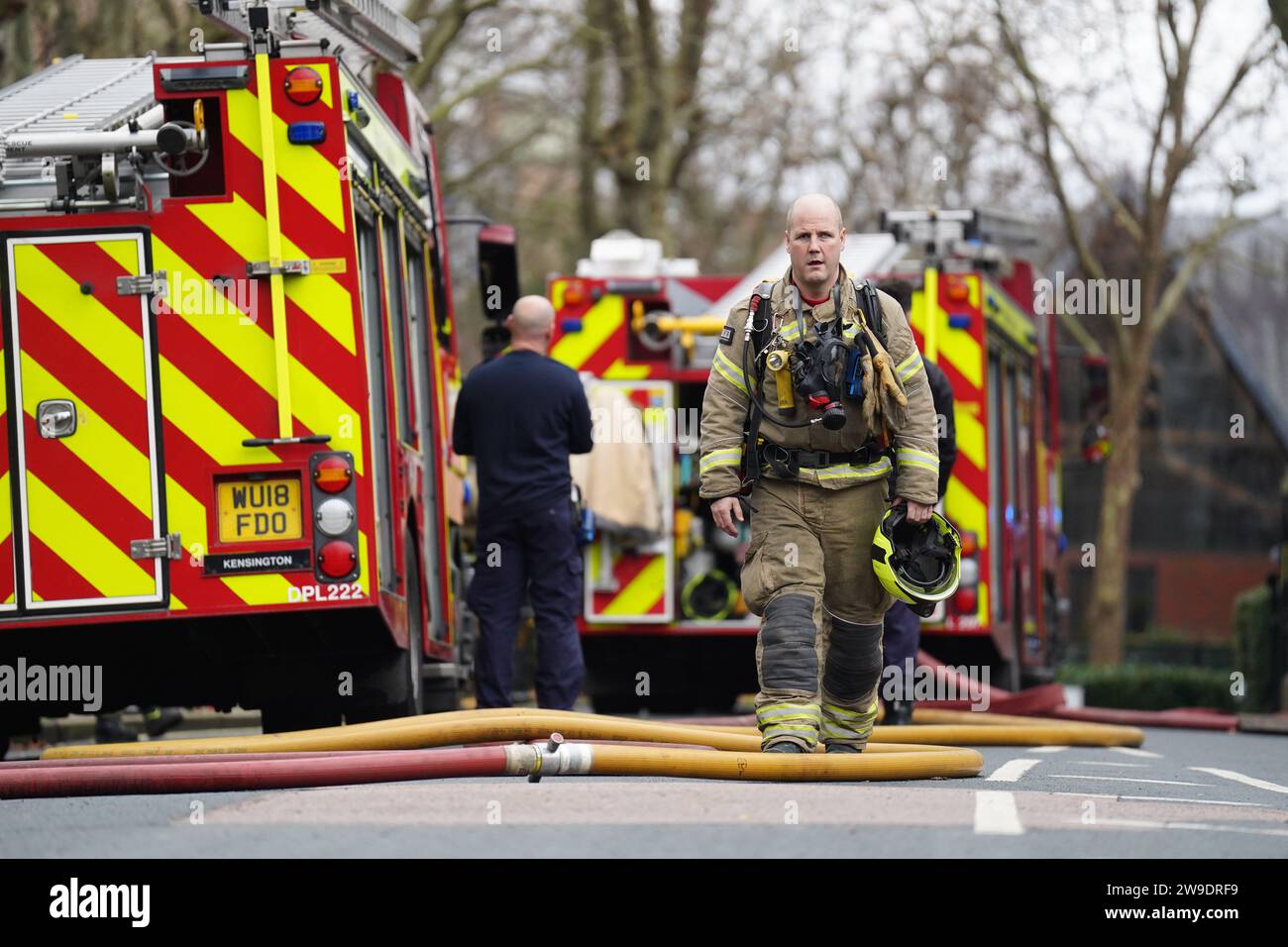 Fire engines on Seagrave Road in Fulham, west London, as firefighters tackle a blaze at London Oratory School. An atrium is alight in the four storey building, the fire brigade said. Picture date: Wednesday December 27, 2023. Stock Photo