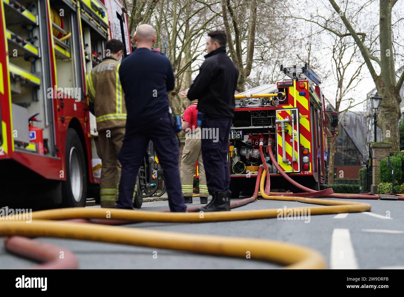 Fire engines on Seagrave Road in Fulham, west London, as firefighters tackle a blaze at London Oratory School. An atrium is alight in the four storey building, the fire brigade said. Picture date: Wednesday December 27, 2023. Stock Photo