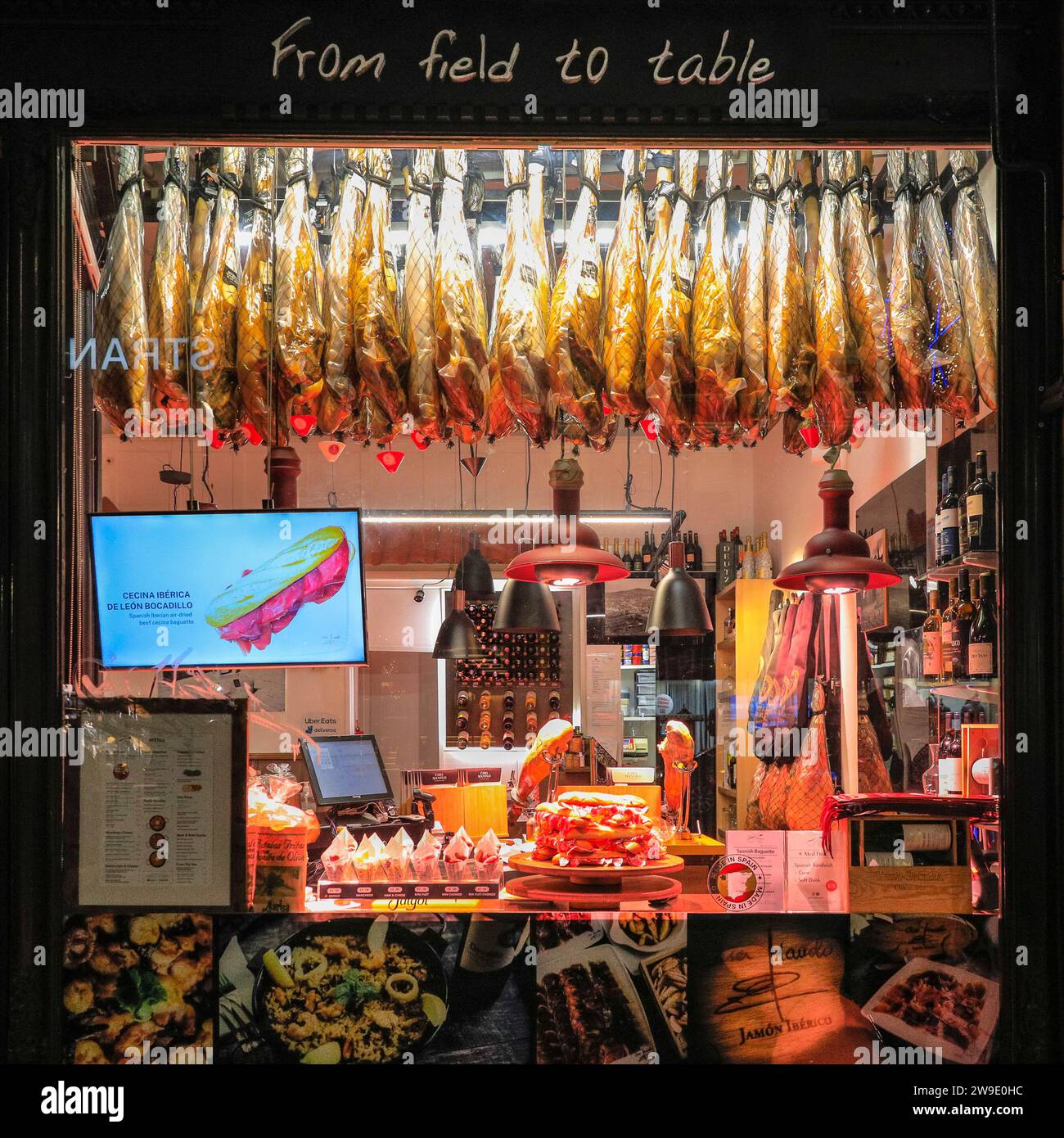 Spanish food and drink shop and bar window of Casa Manolo with Iberico