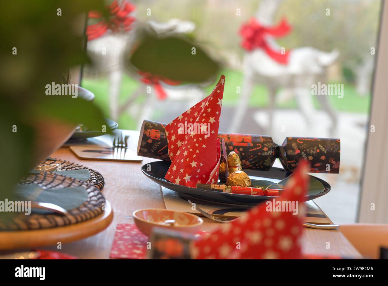 Christmas Table settings, with crackers, festive decorations, place