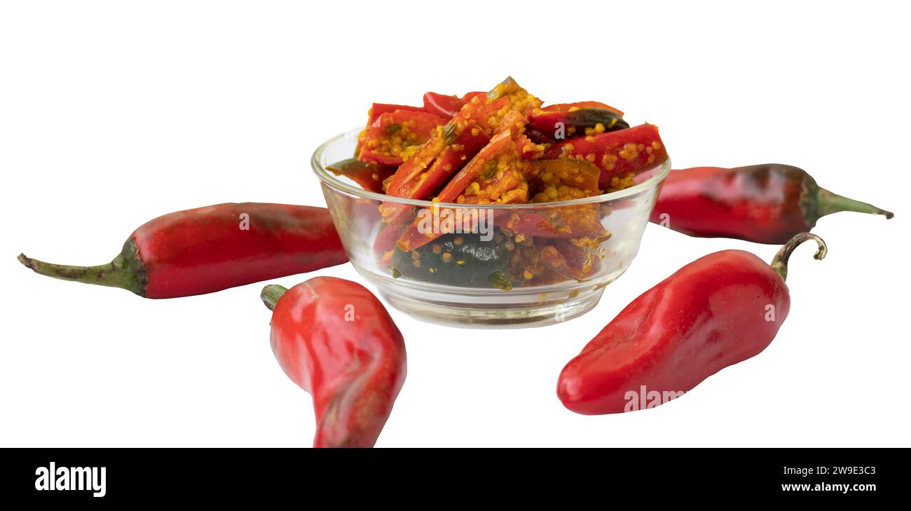 Red chili pickle in transparent glass bowl marinated with Fenugreek