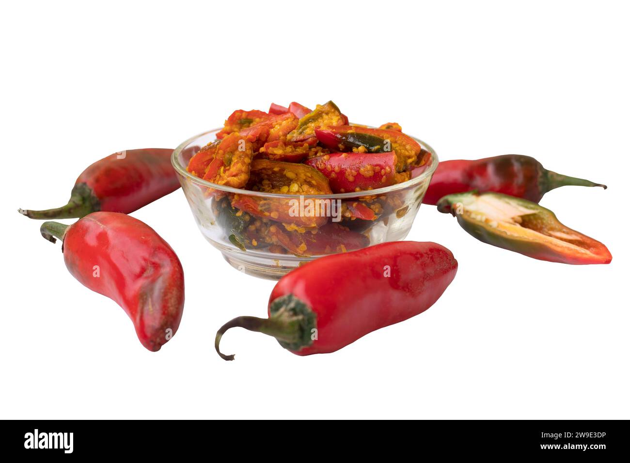 Red chili pickle in transparent glass bowl marinated with Fenugreek