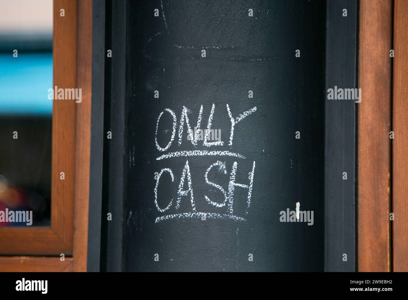 Tokyo, Japan; 1st October 2023: Only cash written on a black board. Stock Photo