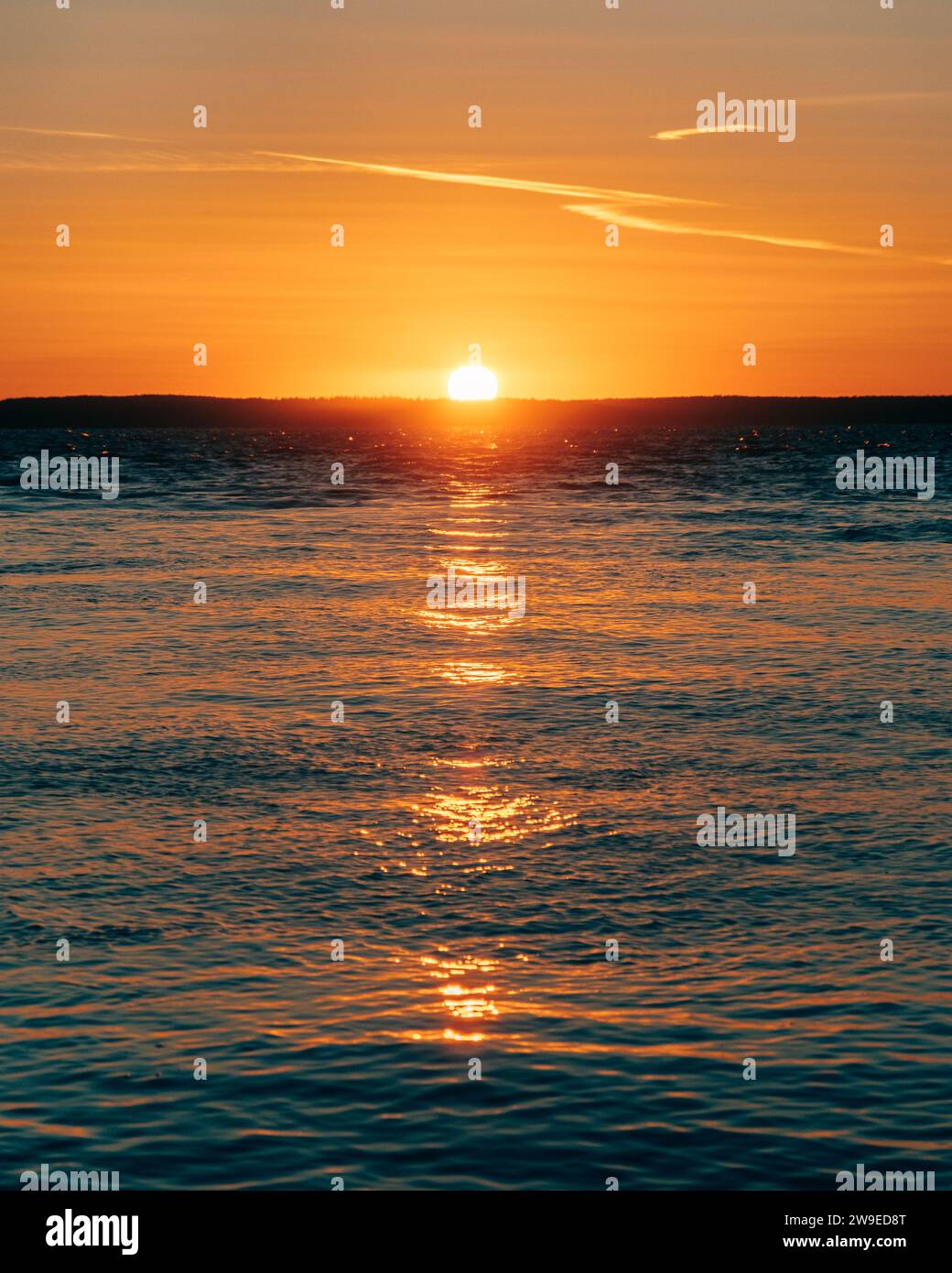 Sunset over the Atlantic Ocean in Bass Harbor, Tremont, Maine Stock Photo