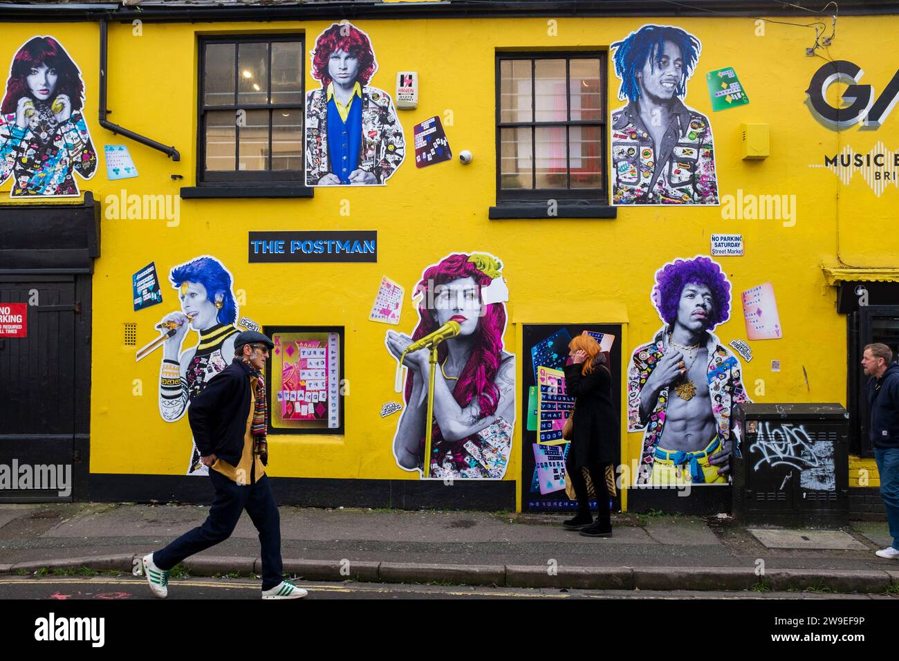 Mural of artwork by The Postman depicting famous musicians at the Guitar Amp & Keyboard store (GAK) in the North Laine district of Brighton UK . The Postman are an anonymous artist whose work can be seen around the city   Credit Simon Dack Stock Photo